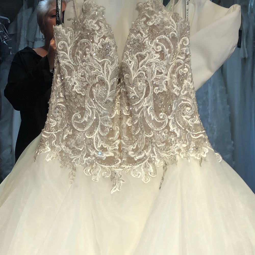 Mon Cheri Bridal ivory gown with beautiful silver and white lace.